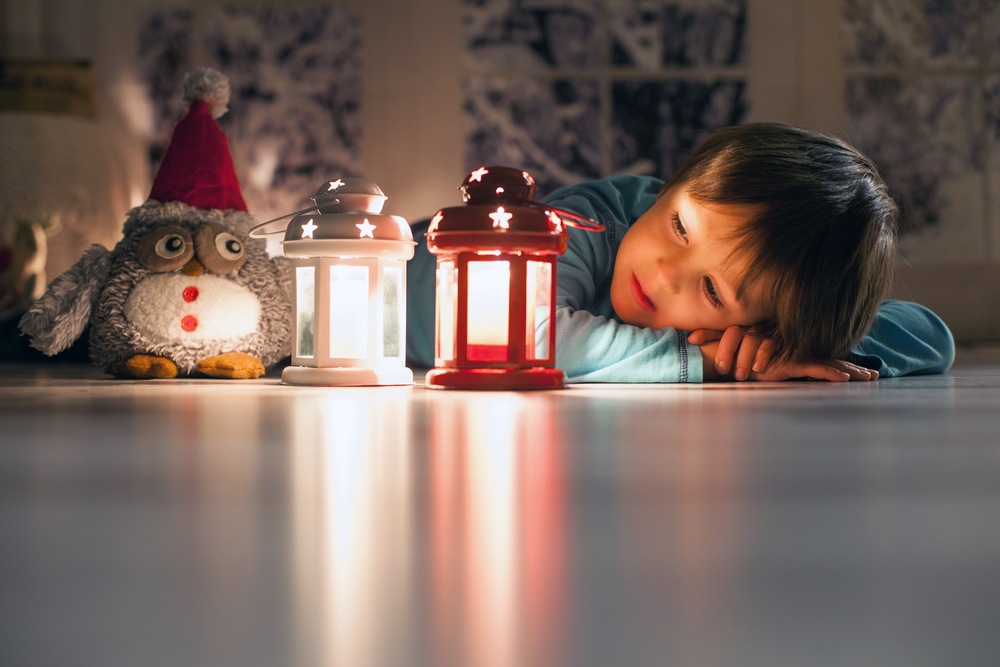 child in blackout, with battery powered night lights feeling safe